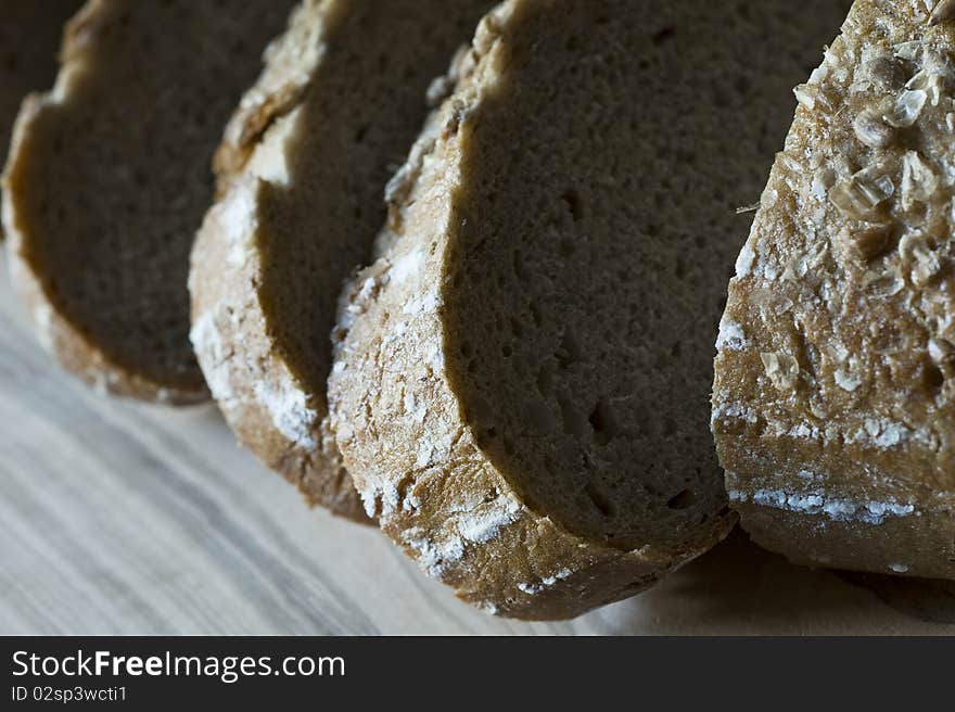 Bread on a wooden cutting board, close-up, selective focus