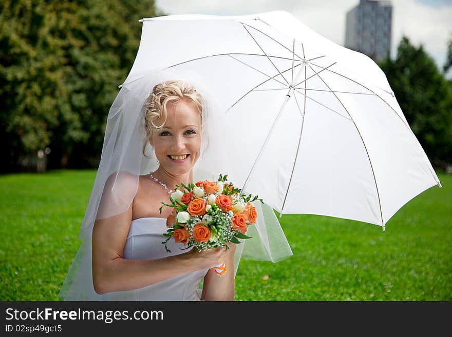 Young beautiful  bride with wedding bouquet. Young beautiful  bride with wedding bouquet