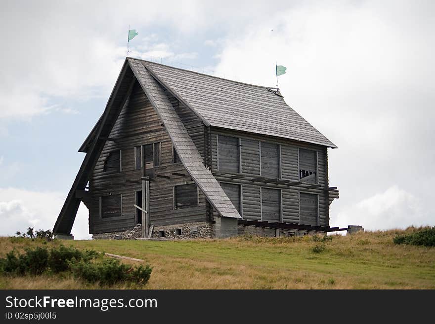 Old wooden derelict house in the mountains. Old wooden derelict house in the mountains