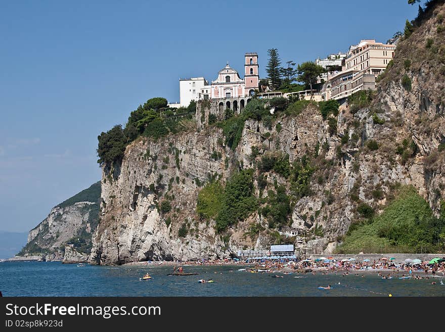 A beach at the foot of cliffs at Vico Equense on the Amalfi Coast. A beach at the foot of cliffs at Vico Equense on the Amalfi Coast