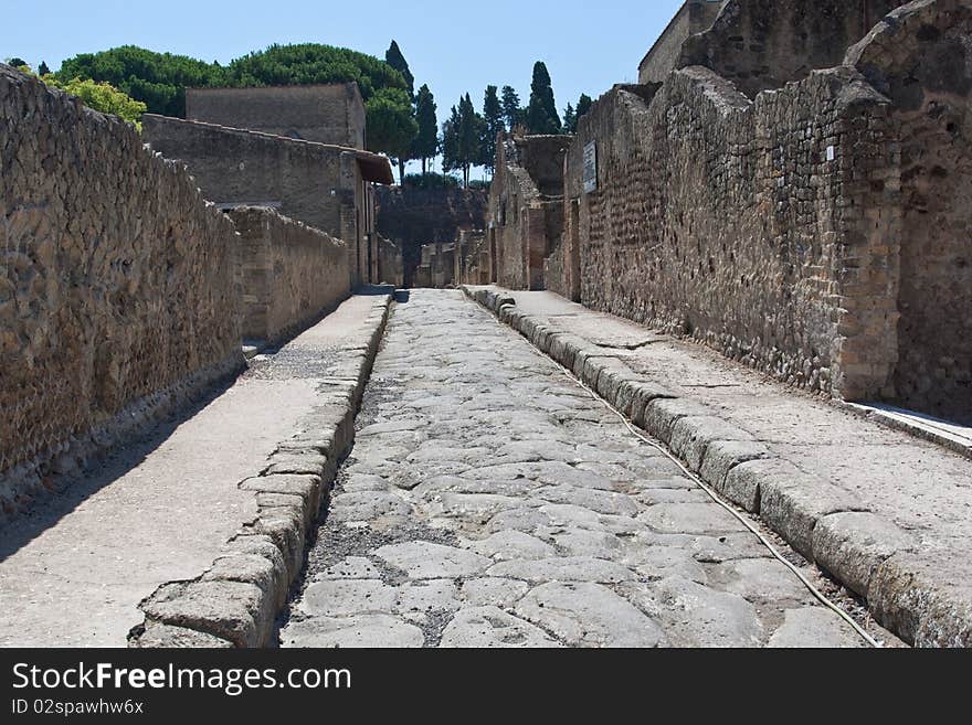 A paved road in Herculaneum at the foot of Mount Vesuvius. A paved road in Herculaneum at the foot of Mount Vesuvius