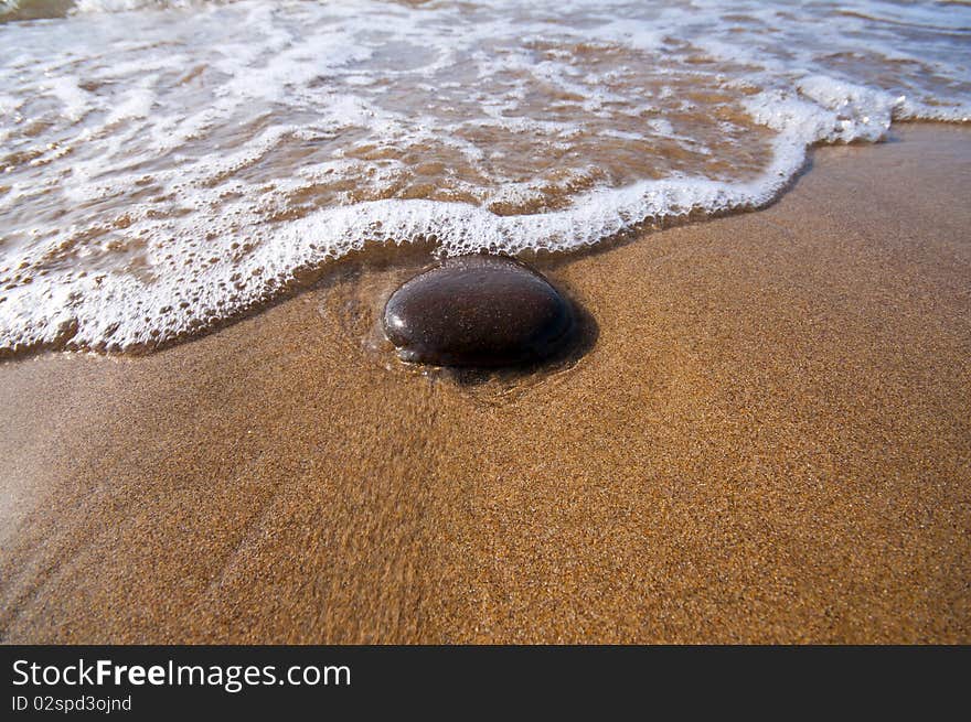 Seashore With Waves And Foam