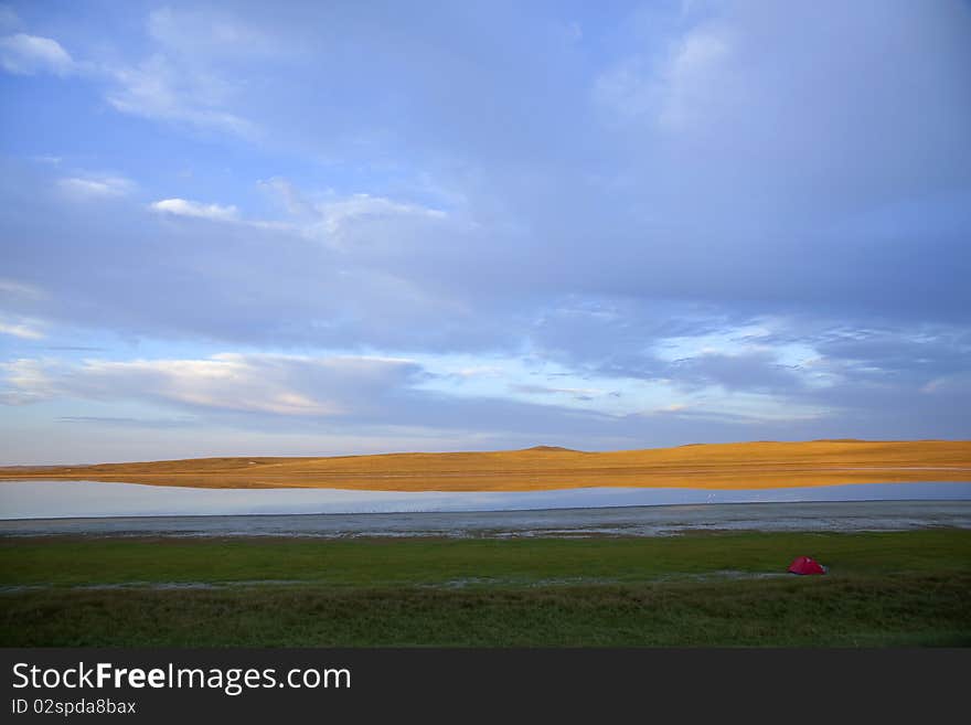 The little red tent in summer prairies. The little red tent in summer prairies.