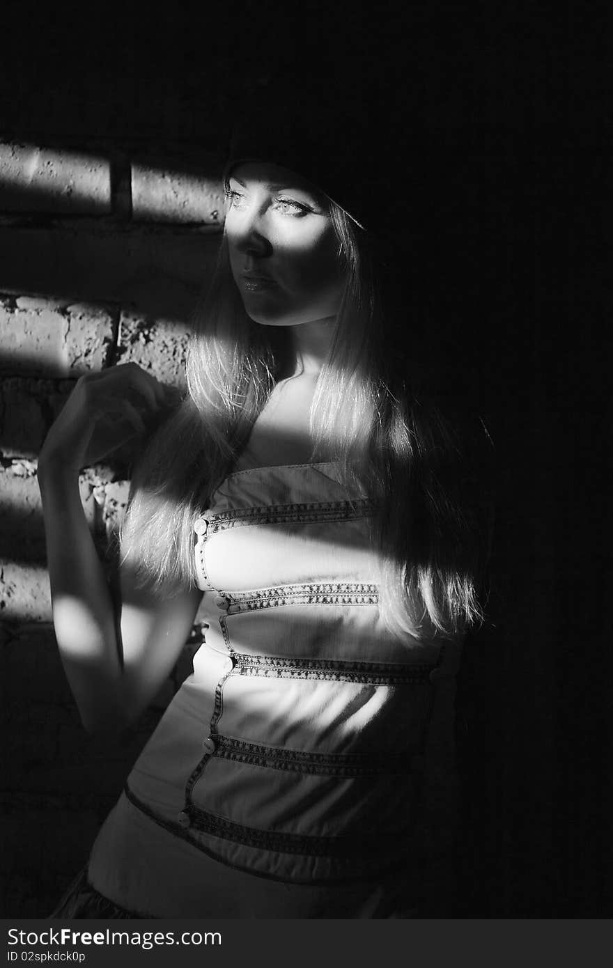 Young Woman Near Old Wall