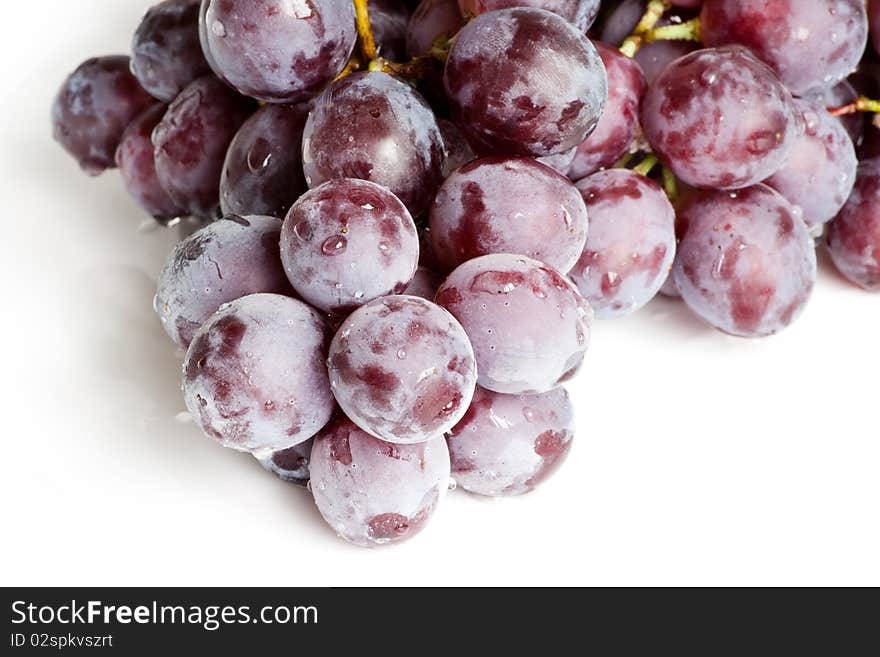 Fresh red grape isolated on white