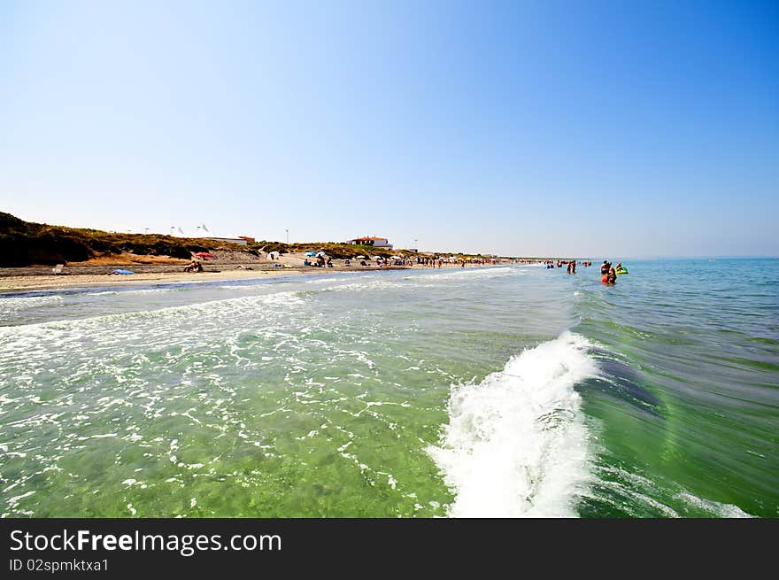 Seashore with waves and foam