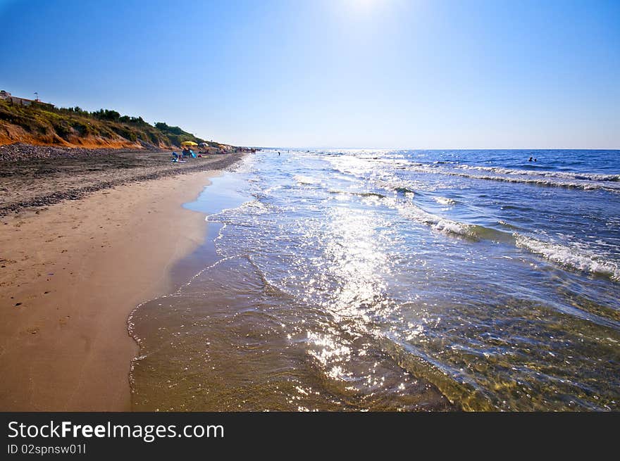 Seashore With Waves And Foam