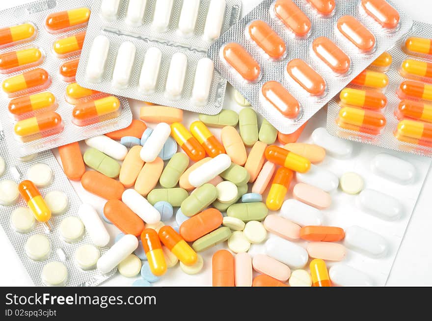 Packs of different pills, close up on white background