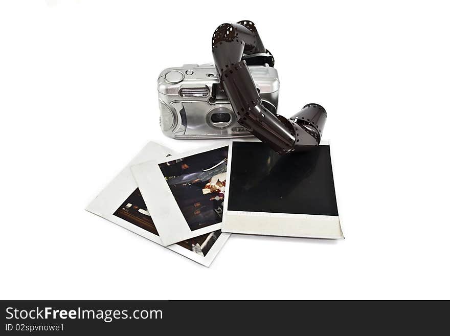 Film camera and some photos isolated on a white background. Film camera and some photos isolated on a white background