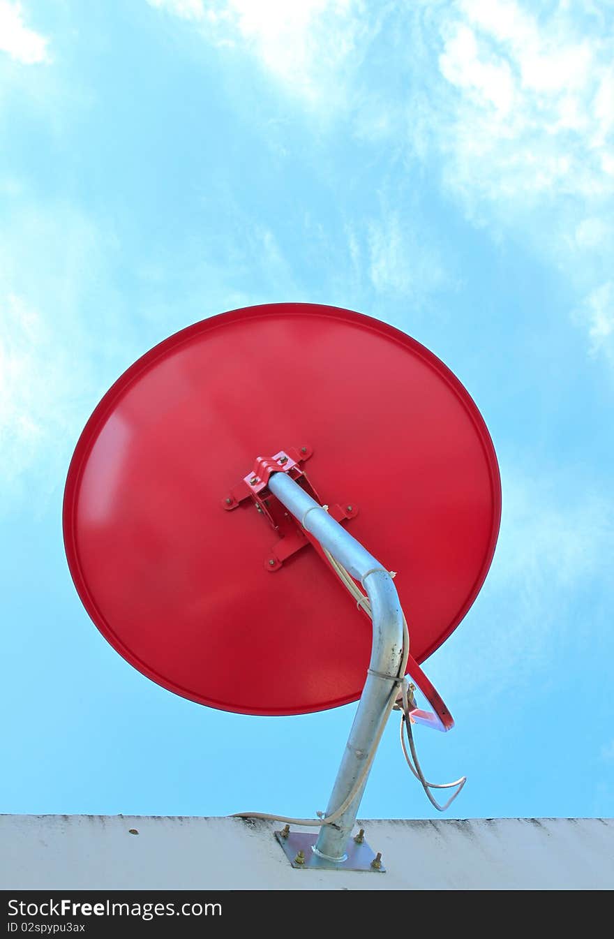 The red satellite dish with blue sky