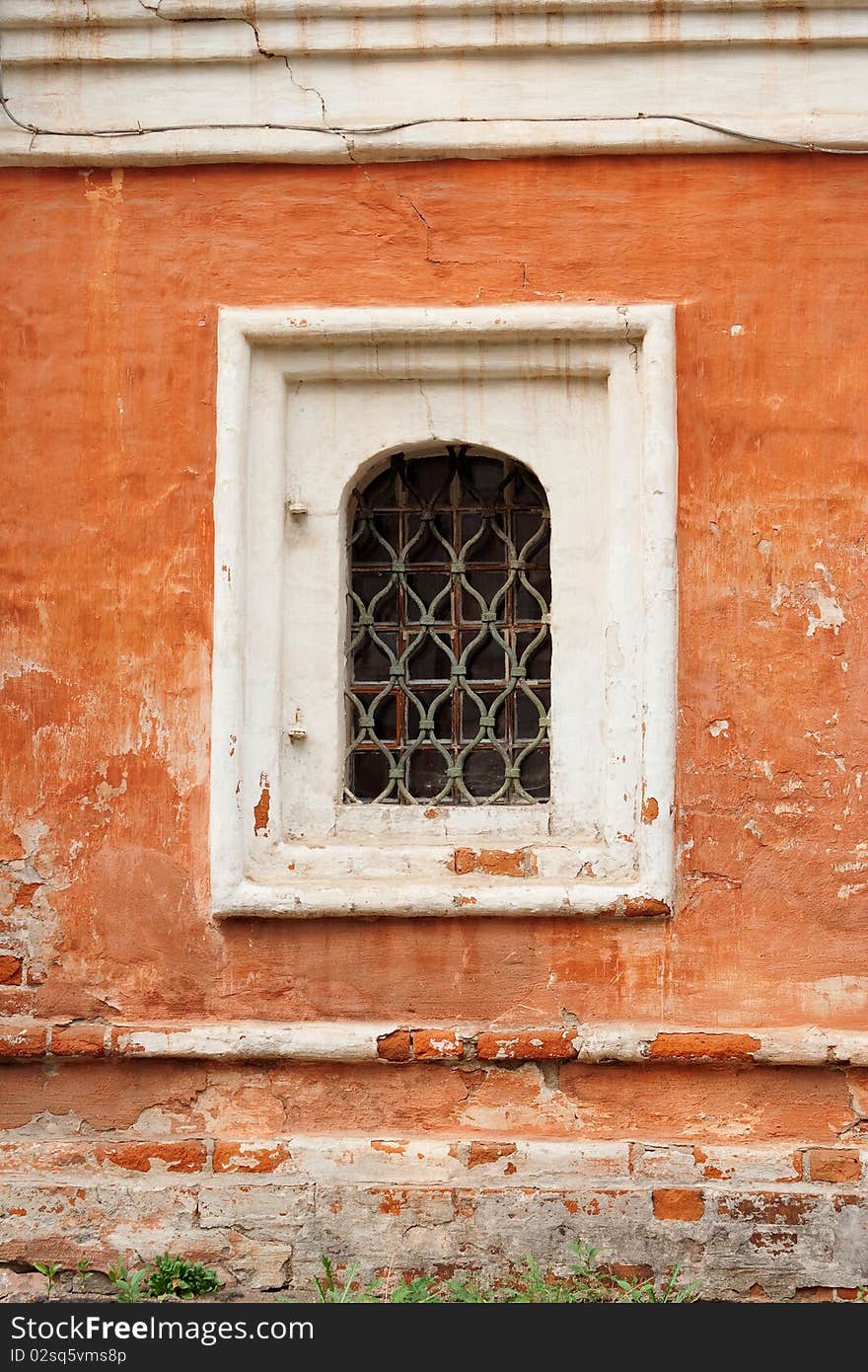 Barred window in the old convent building. Texture, background. Barred window in the old convent building. Texture, background