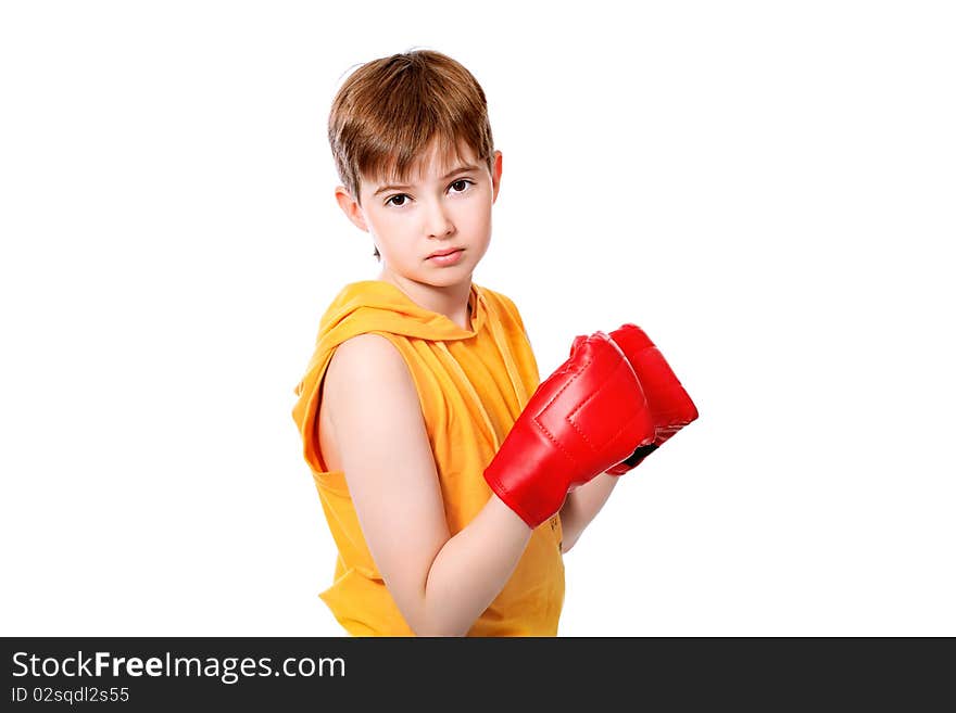 Portrait of a cute sporty boy in boxing gloves. Isolated over white background. Portrait of a cute sporty boy in boxing gloves. Isolated over white background.