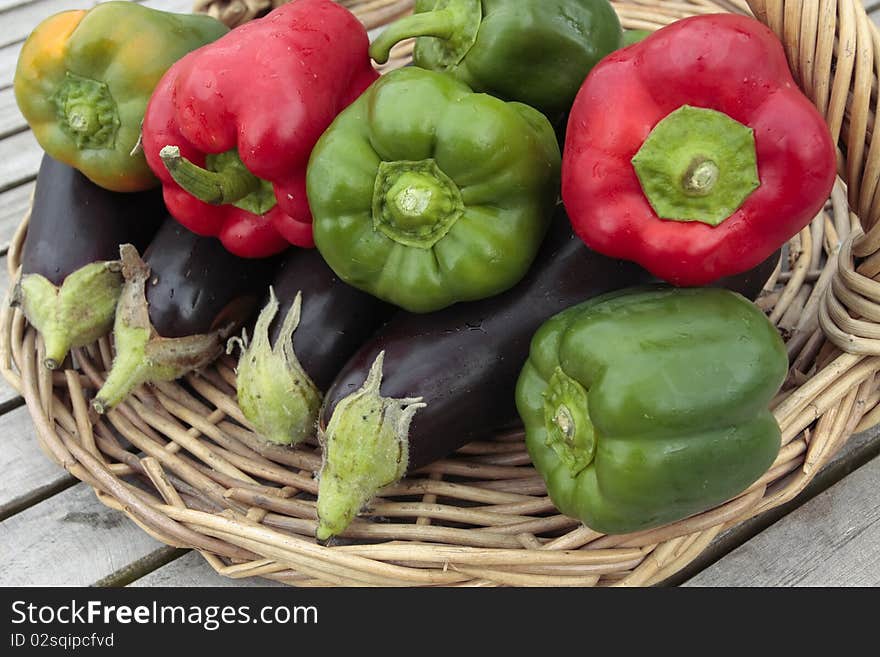 Ripe peppers and aubergine vegetables on  basket