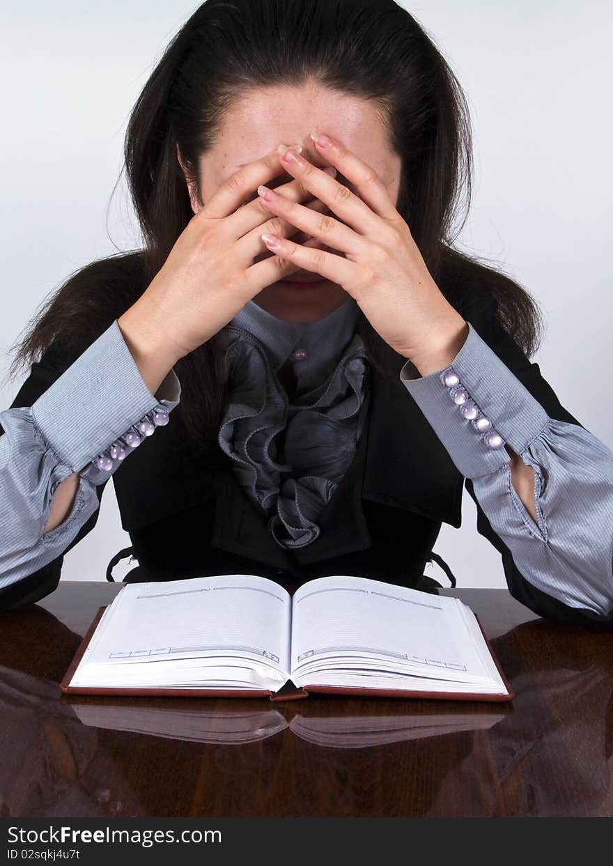 Businesswoman sitting at the desk stressed and have a problem. Businesswoman sitting at the desk stressed and have a problem