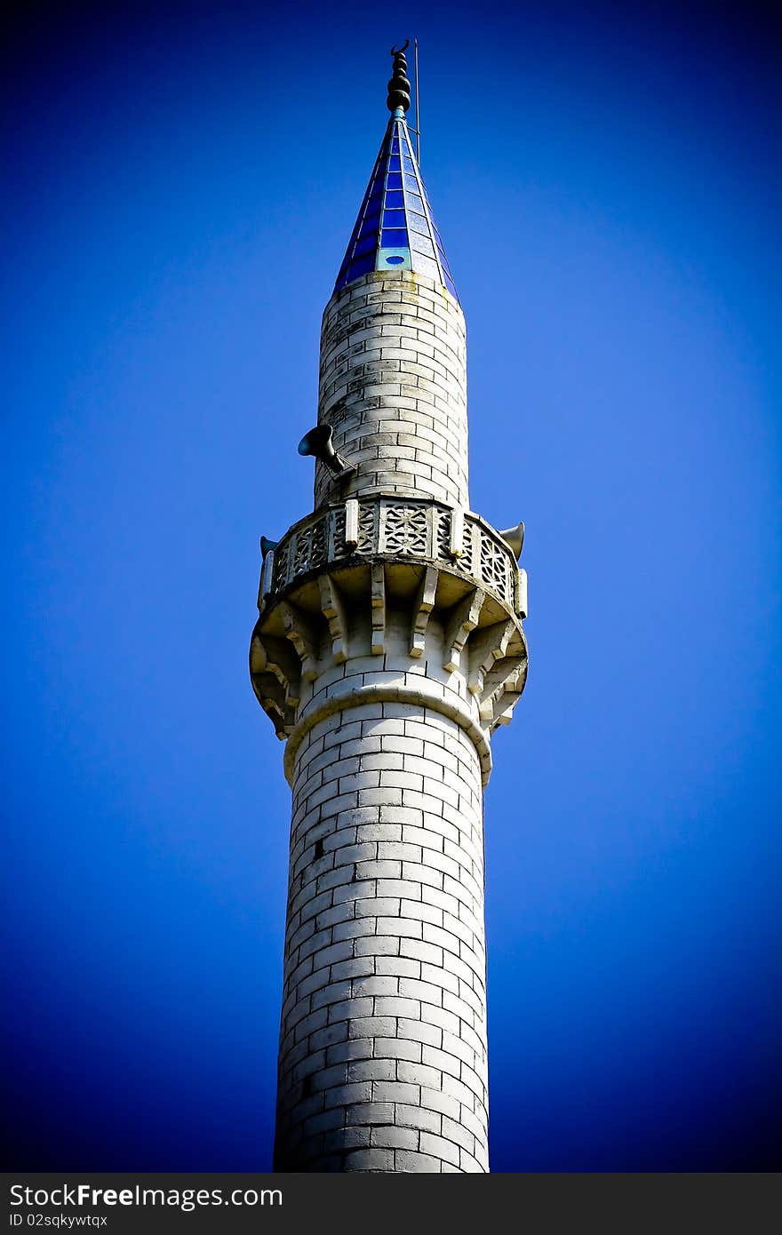 Mosque set against blue sky with vignette