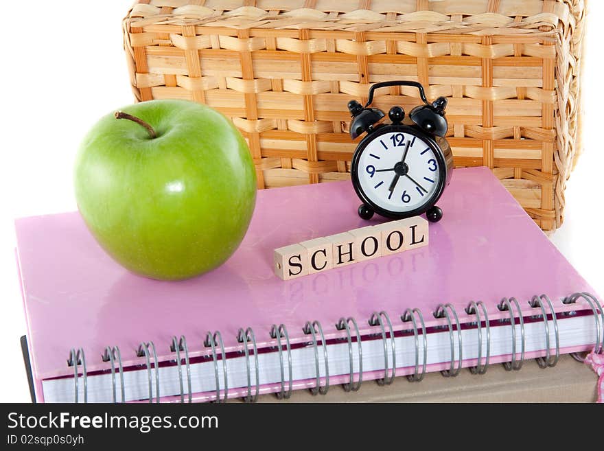 School notebooks and a healthy lunch isolated over white. School notebooks and a healthy lunch isolated over white