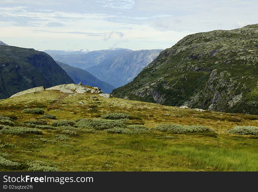 Jotunheim mountains with clouds on sky, Norway