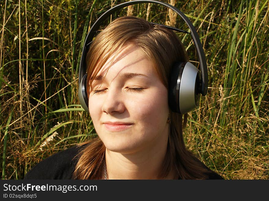 Young woman listening to music.