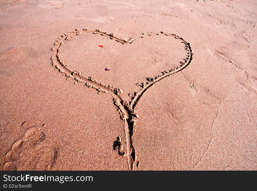 Heart written in the sand