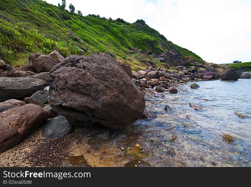 Seashore With Waves And Foam