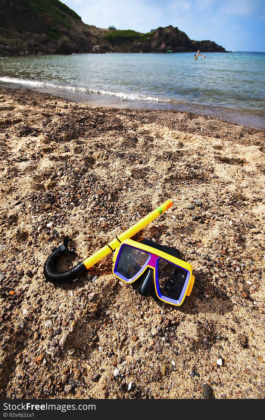 Diving mask and snorkel on the beach in summer. Diving mask and snorkel on the beach in summer