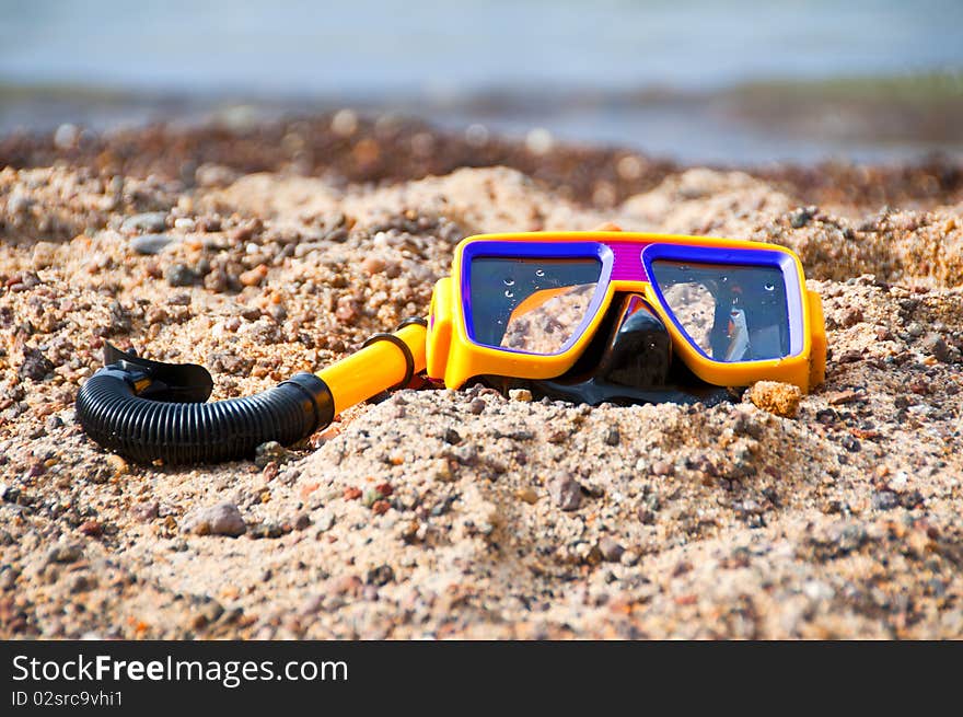 Diving mask and snorkel on the beach in summer. Diving mask and snorkel on the beach in summer