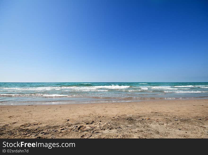 Seashore with waves and foam