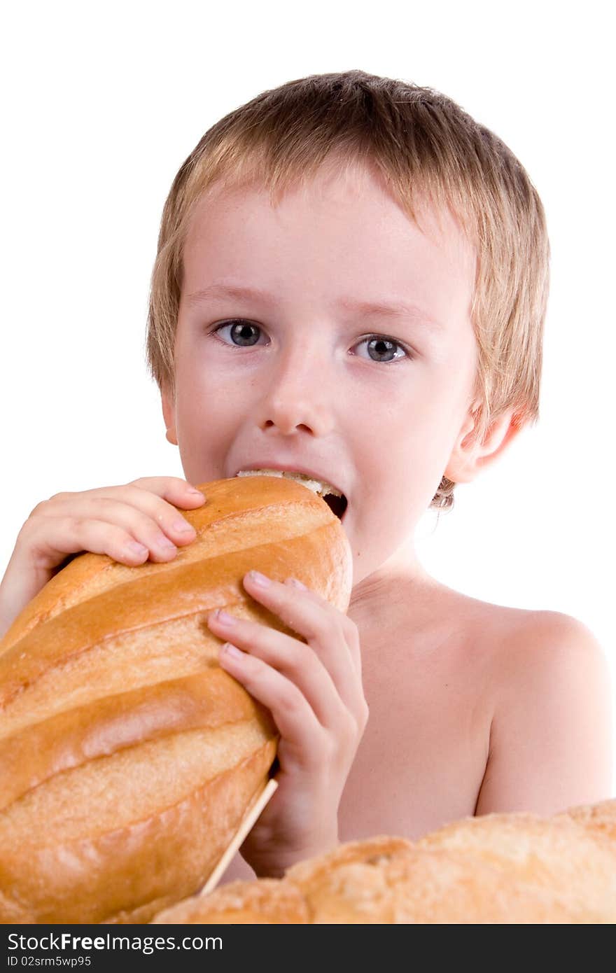 Happy boy eating bread on a white background