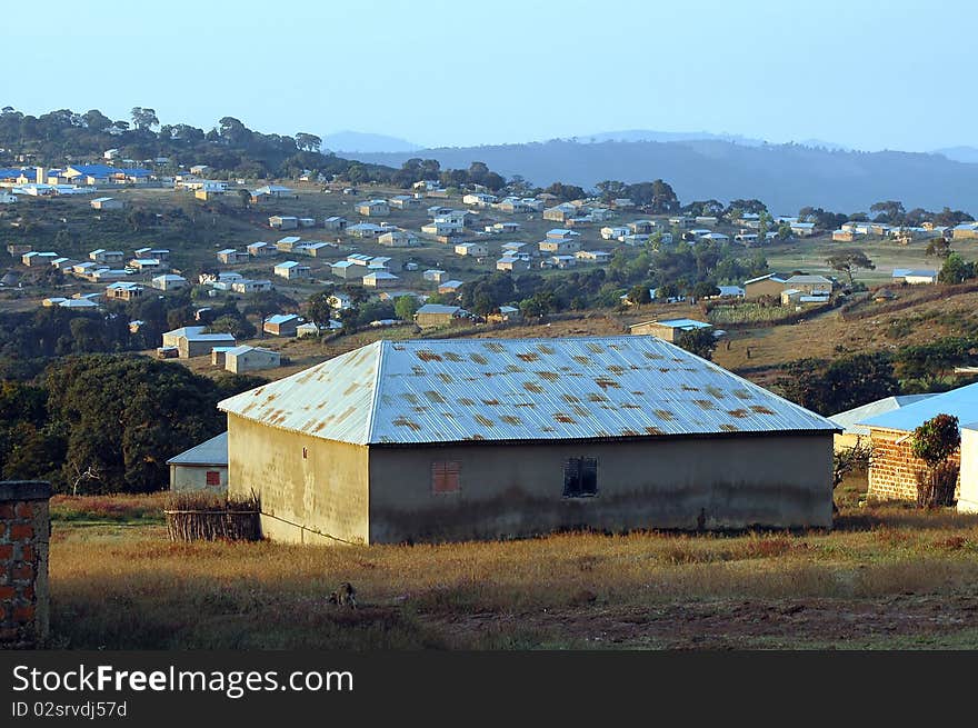 A close up of a house in Maliville with the town behind. A close up of a house in Maliville with the town behind