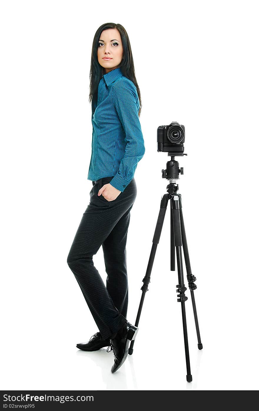 Portrait of beauty brunette with tripod and camera on white. Portrait of beauty brunette with tripod and camera on white