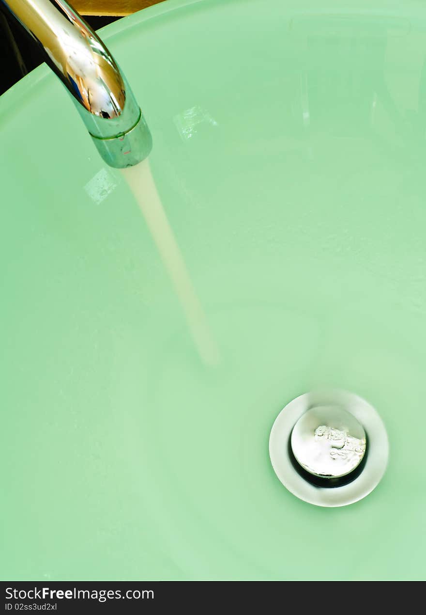 A wash basin with faucet as a background