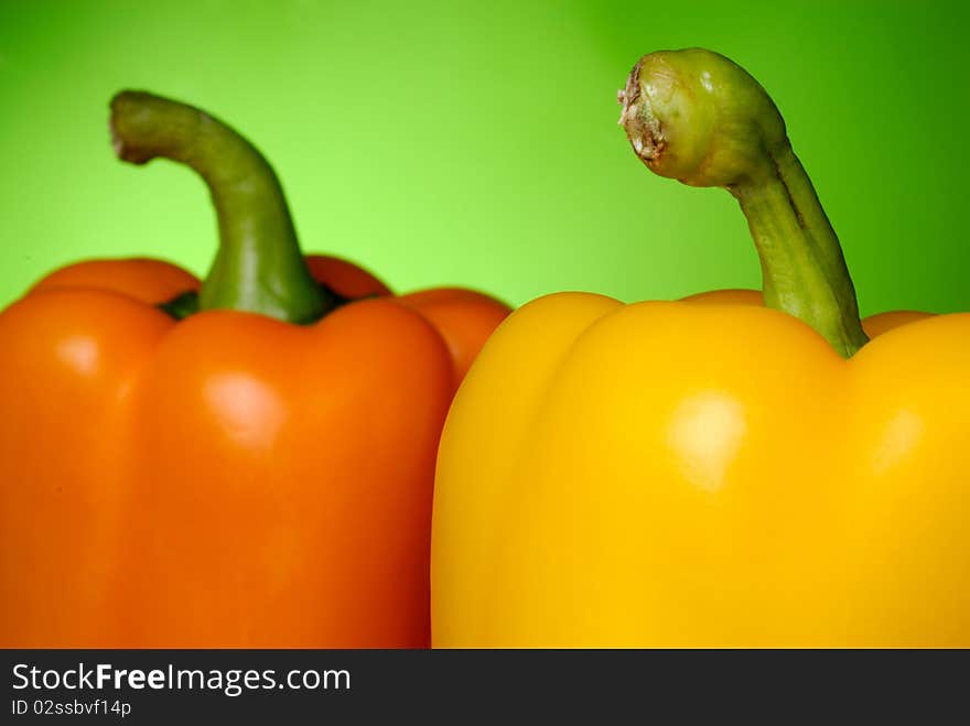 Sweet peppers on green background. Sweet peppers on green background