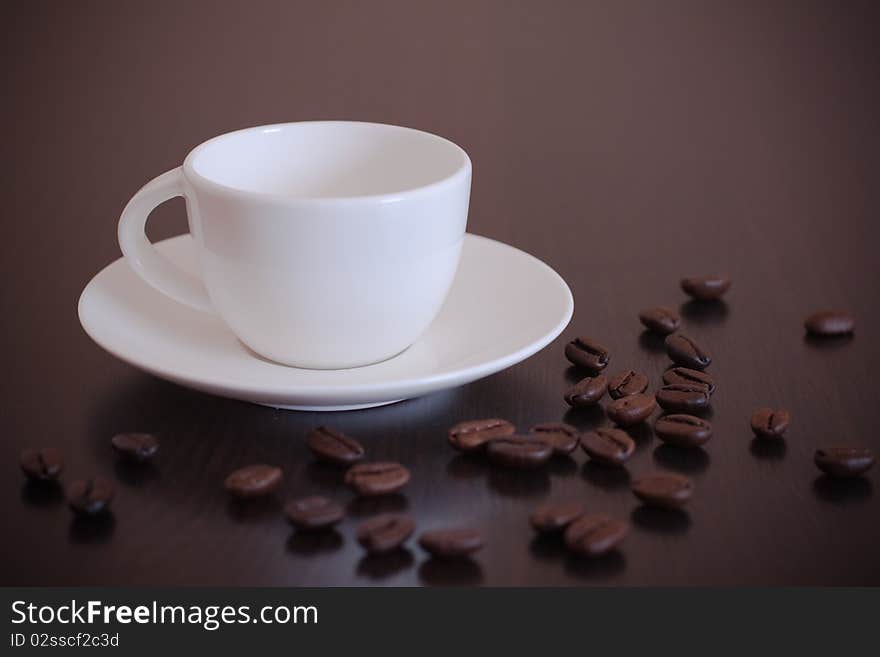 Empty coffee cup with grains