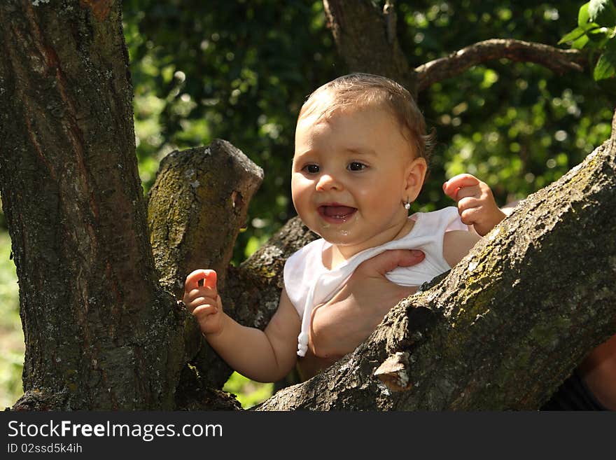 Happy baby in the forest