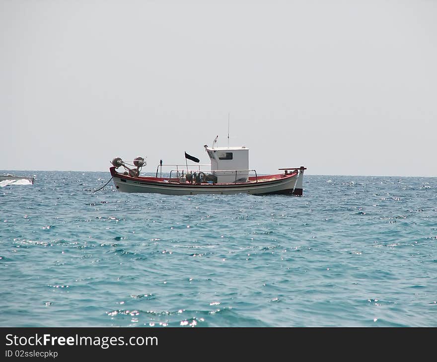 Fishing boat on the sea.
Fishing boat.