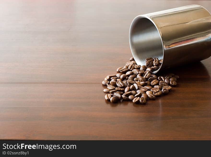 Coffee beans on brown table