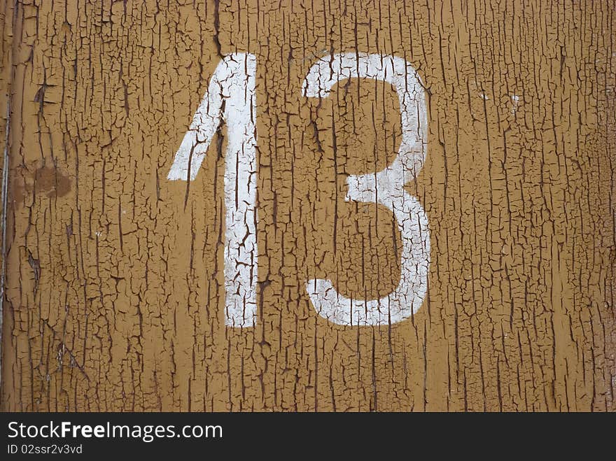 Number thirteen on the old peeled yellow paint. Number thirteen on the old peeled yellow paint