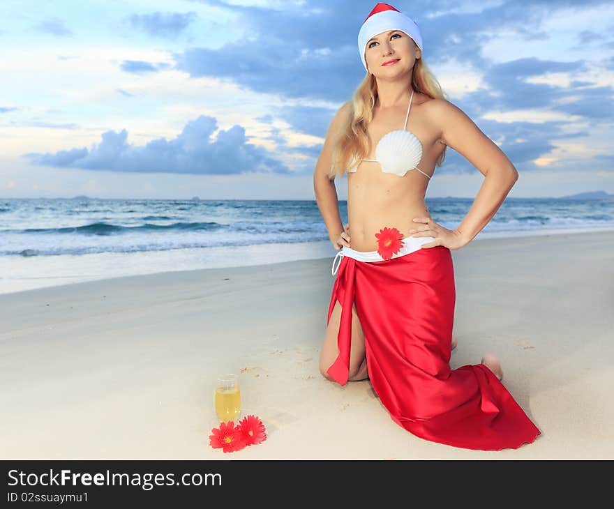 Miss Santa celebrates Christmas at the tropical beach. Miss Santa celebrates Christmas at the tropical beach