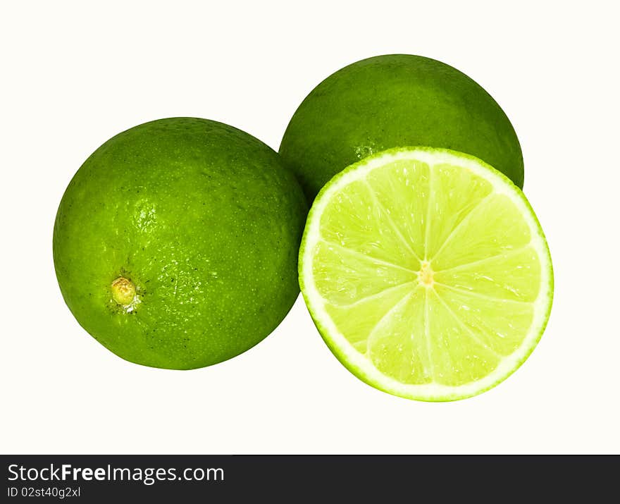 Two limes and half isolated on a white background