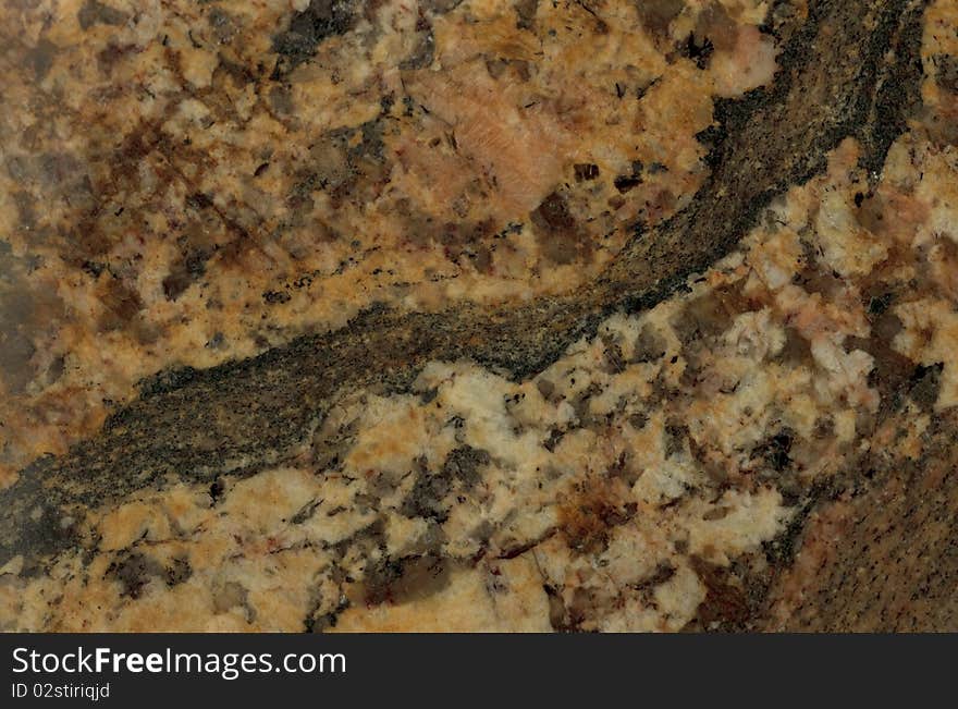 Surface of the stone. Granite. Reddish-brown shades. Surface of the stone. Granite. Reddish-brown shades.