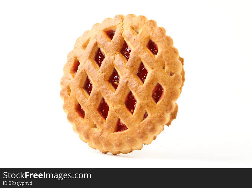 Jelly round shape cookie hanging on the isolated background. Jelly round shape cookie hanging on the isolated background