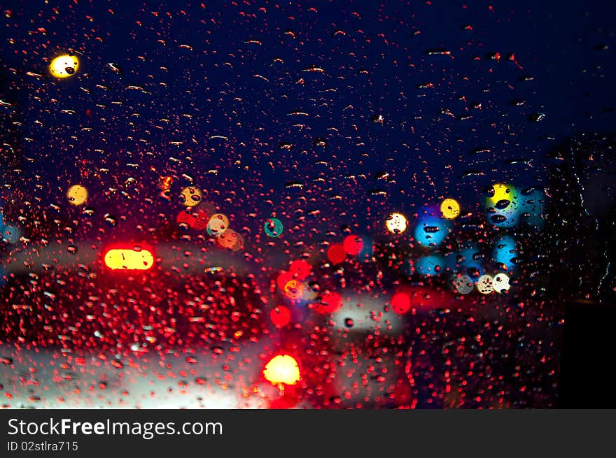 Water drop on glass with colorful lighting