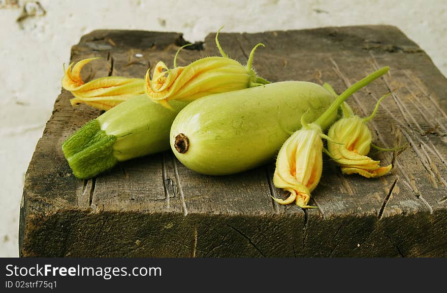 Zucchini on wooden table