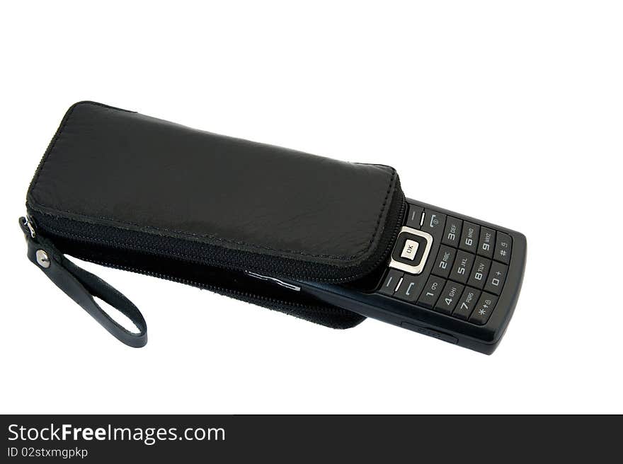 The black mobile phone packed into a leather case. The black mobile phone packed into a leather case