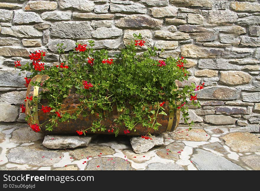 Wooden vase with red flowers Gerner. Wooden vase with red flowers Gerner