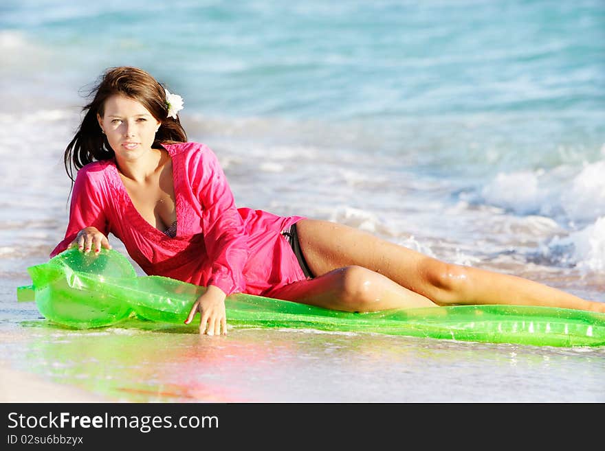 Young beautiful woman on beach