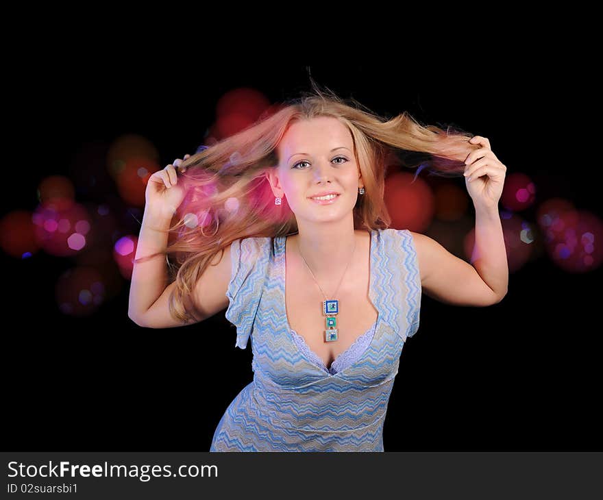 A young girl cheerfully spends time in a disco