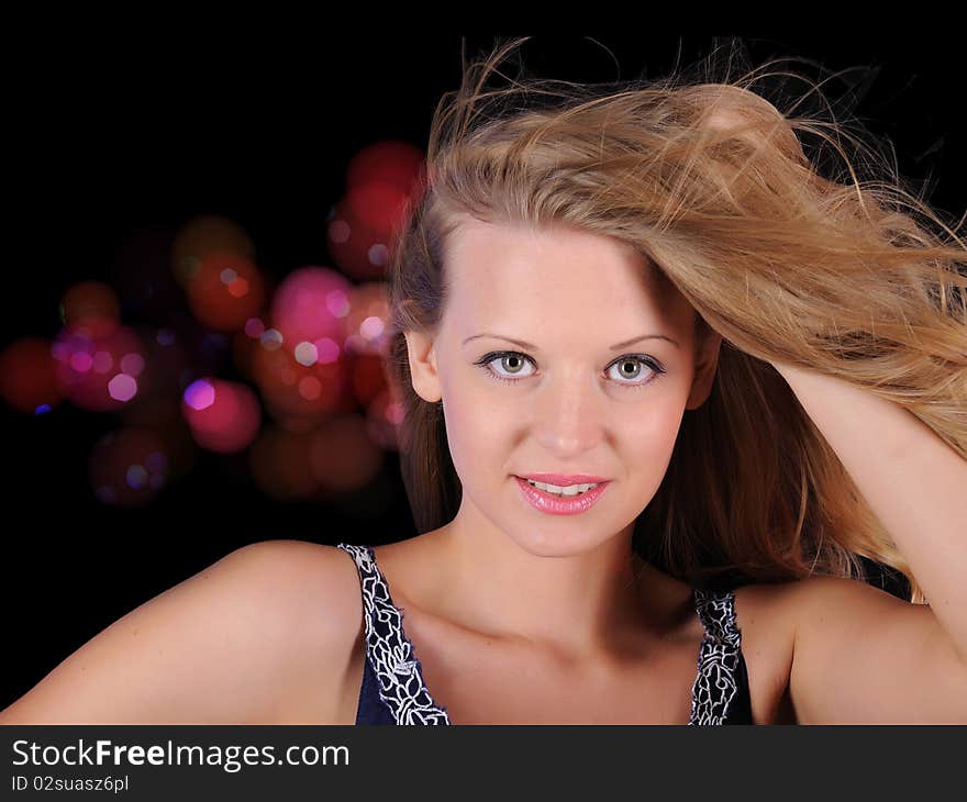 A young girl cheerfully spends time in a disco