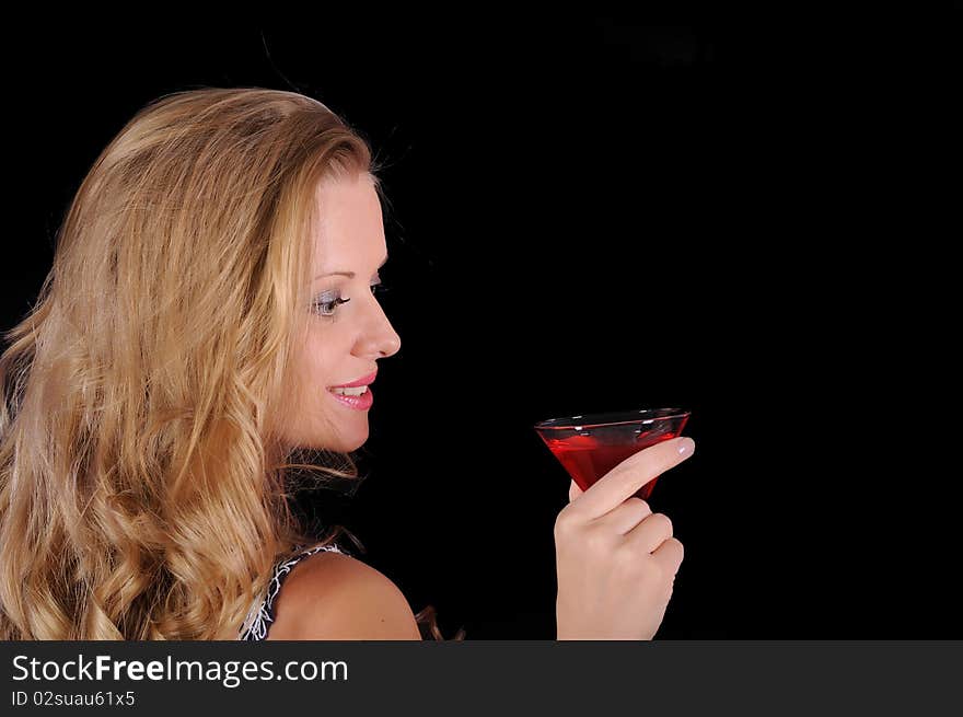 Young girl with a glass and a glass of red drink.