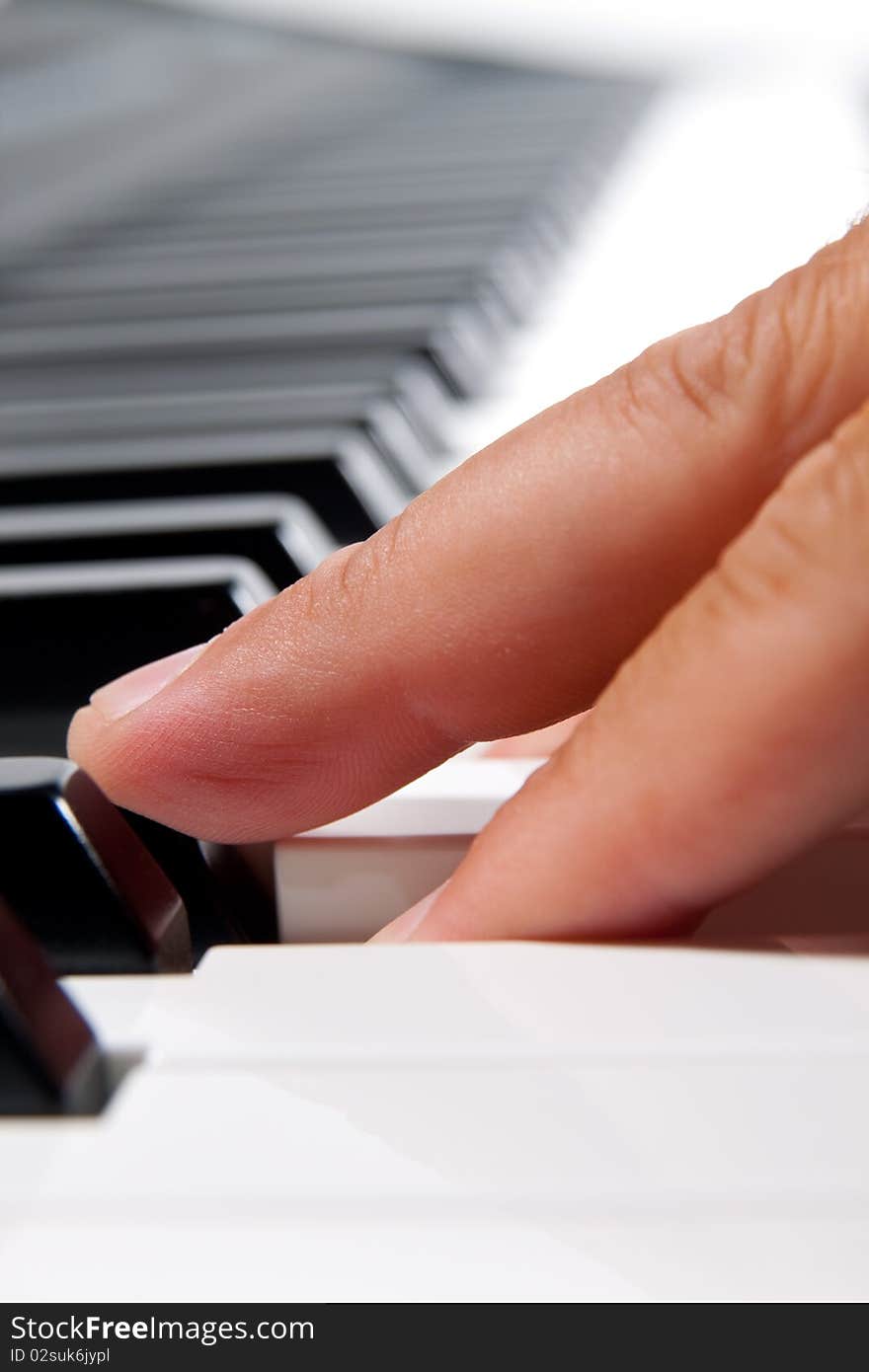 Close-up of a electronic piano keyboard on white